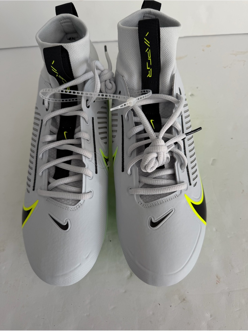 Nike Men’s White Athletic Cleats with Neon Yellow Accents